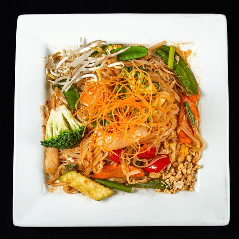 Thai Chilli Pepper's Pad See Ew with noodles, broccoli, carrots, bean sprouts, and peanuts.